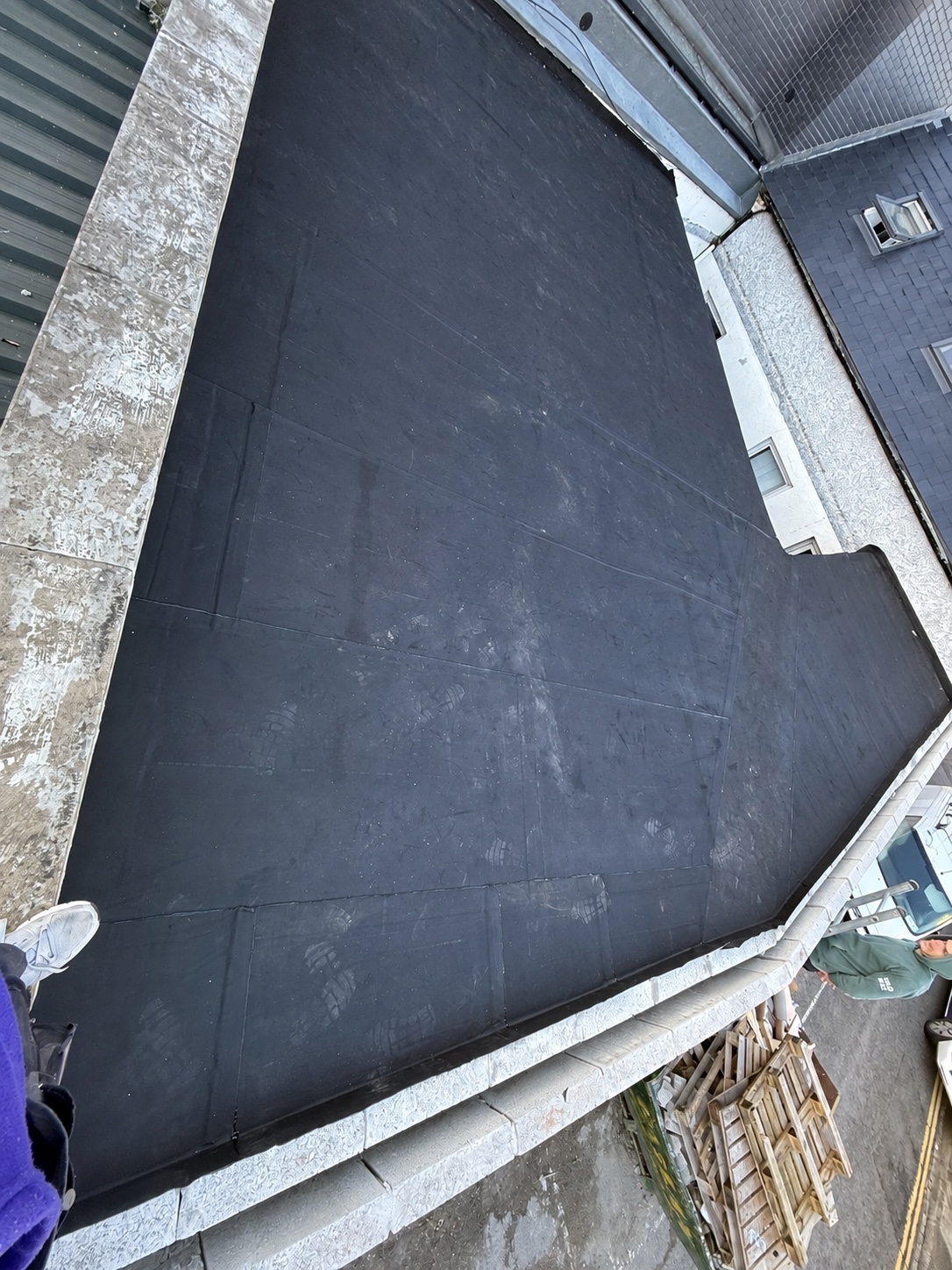 Dark felt flat roof surface